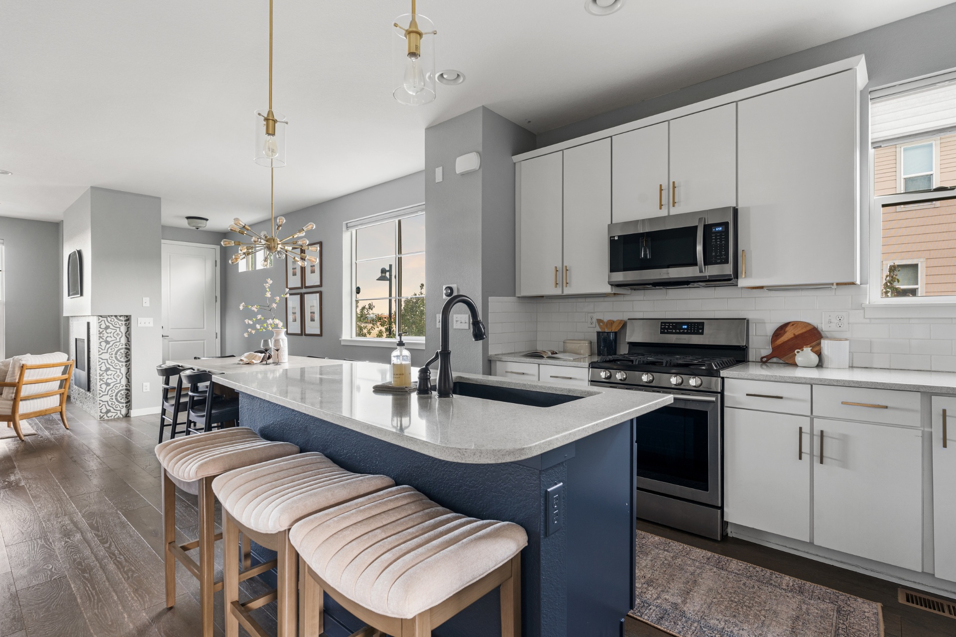Kitchen island with seating and stainless appliances