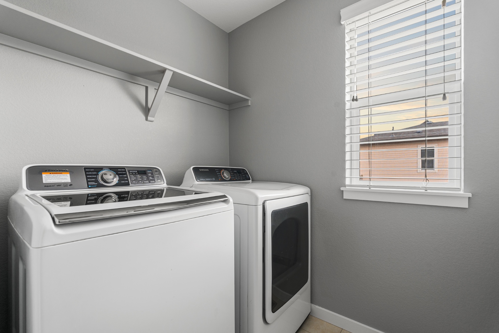 Dedicated laundry room with washer and dryer