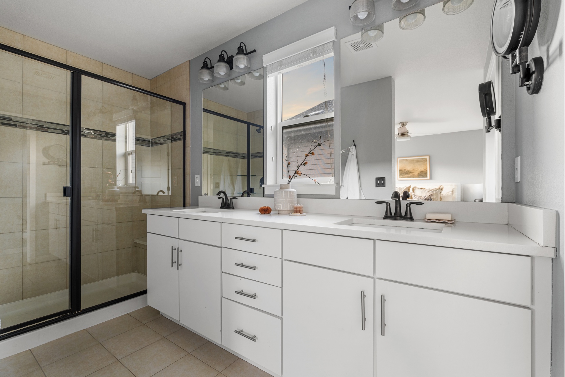 Primary bathroom with double vanity and walk-in shower